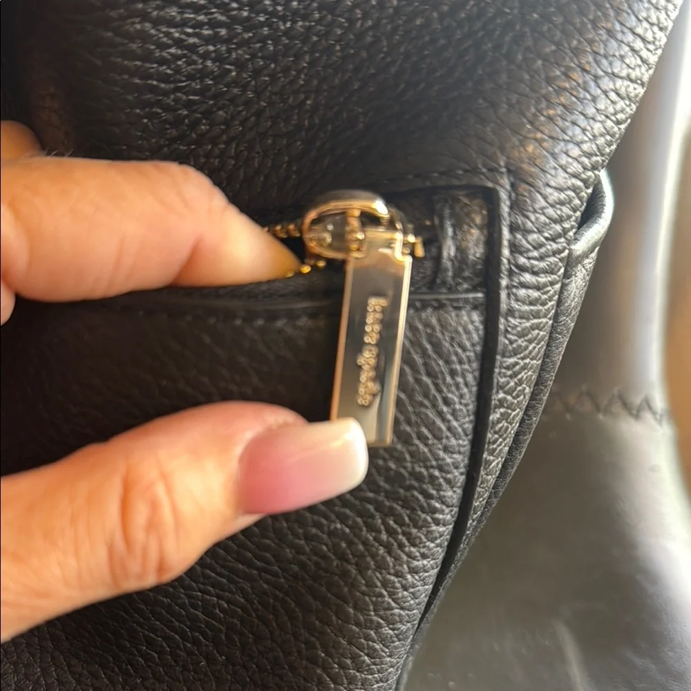kate spade Black Pebbled Leather Mini Backpack with Gold Accents